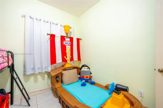 a kitchen with granite countertop stainless steel appliances sink and window