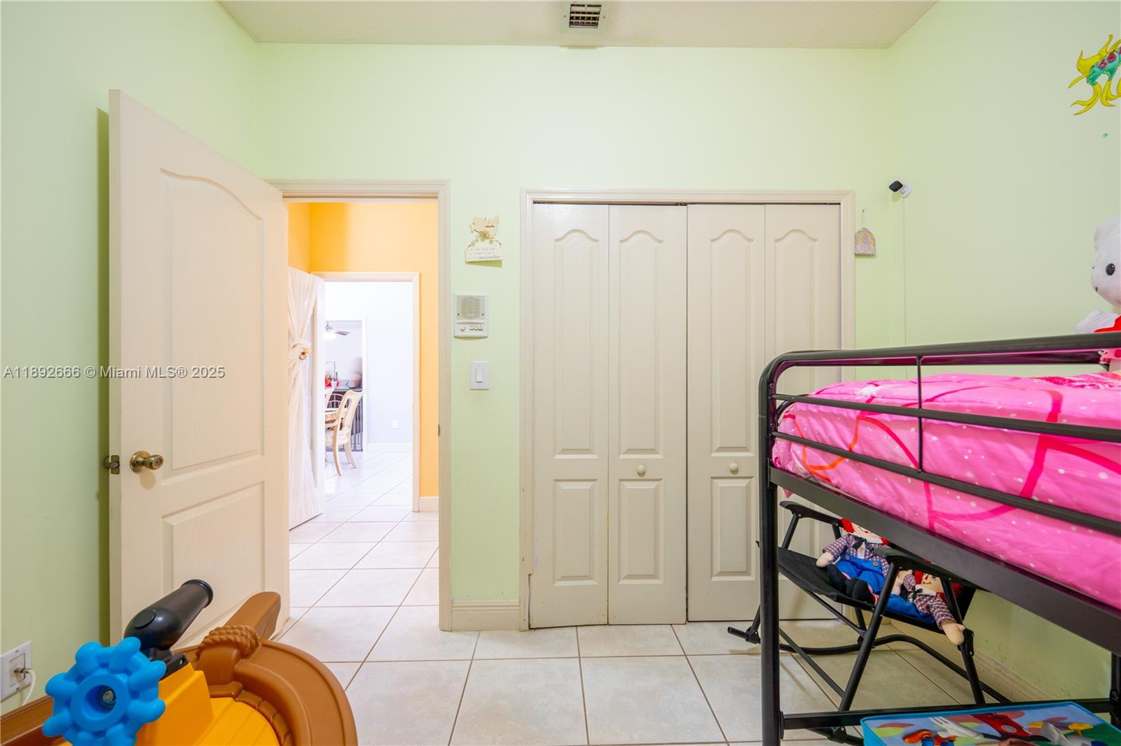 2275 Southwest 143rd Court Miami, FL 33175 - Photo 26 of 64 a bedroom with a bed and a table