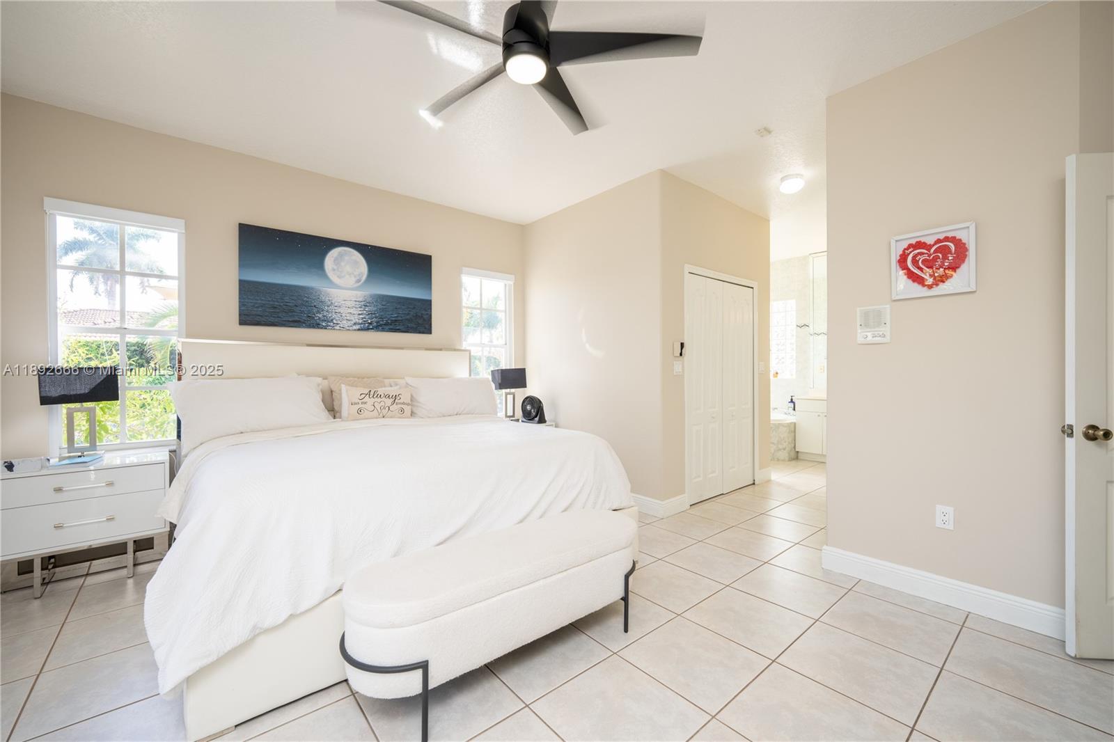 2275 Southwest 143rd Court Miami, FL 33175 - Photo 27 of 64 a spacious bedroom with a bed and a chandelier