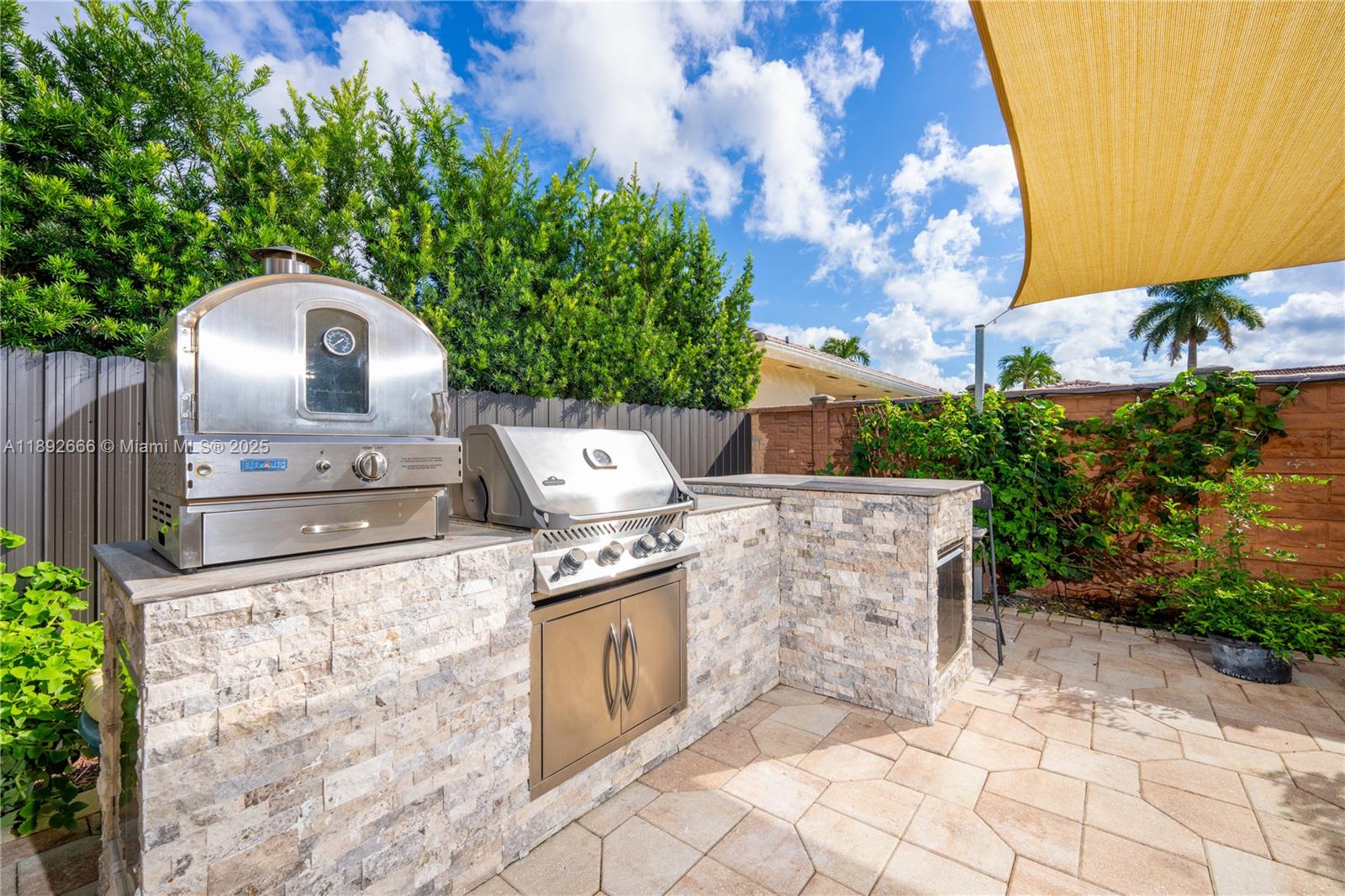 2275 Southwest 143rd Court Miami, FL 33175 - Photo 3 of 64 a view of a wooden house with a yard and a large tree