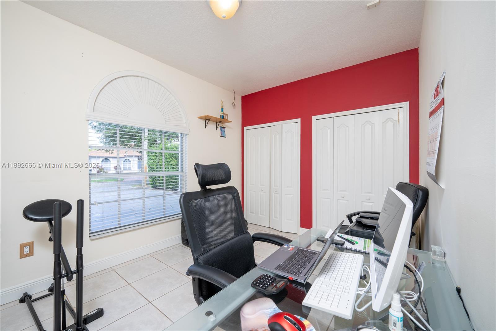 2275 Southwest 143rd Court Miami, FL 33175 - Photo 38 of 64 a living room with furniture a rug potted plant and a large window