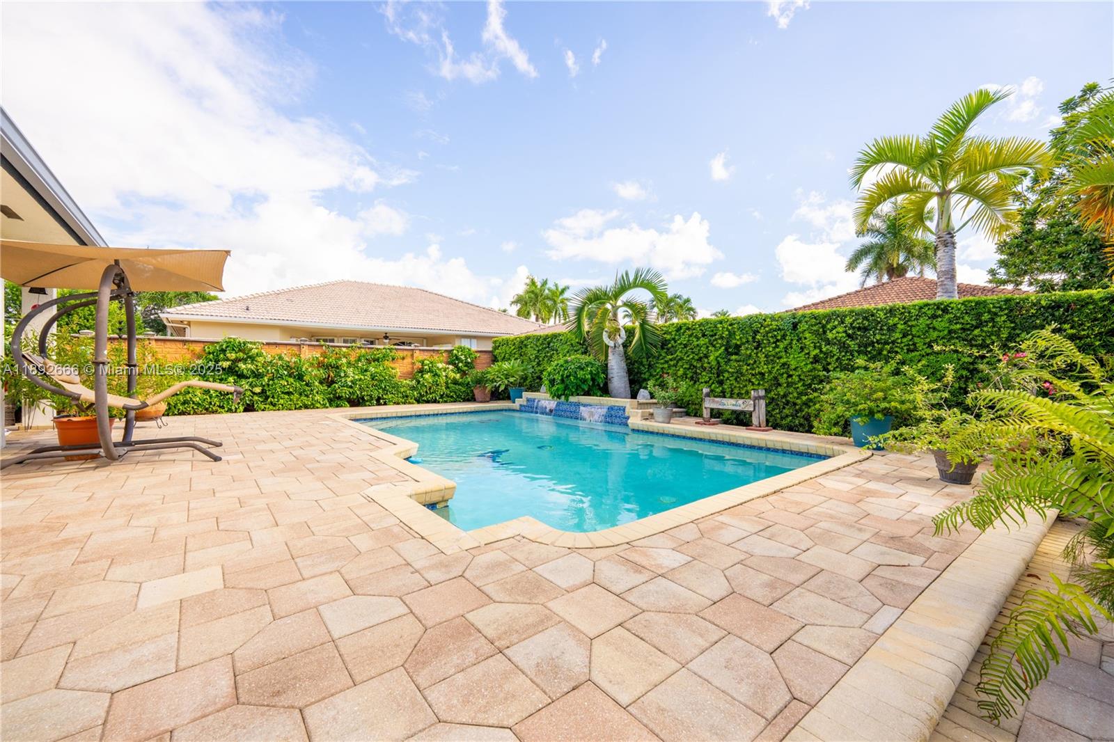 2275 Southwest 143rd Court Miami, FL 33175 - Photo 4 of 64 a view of a swimming pool and a yard