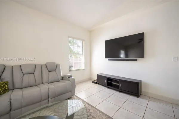 an aerial view of a house with a swimming pool yard and outdoor seating