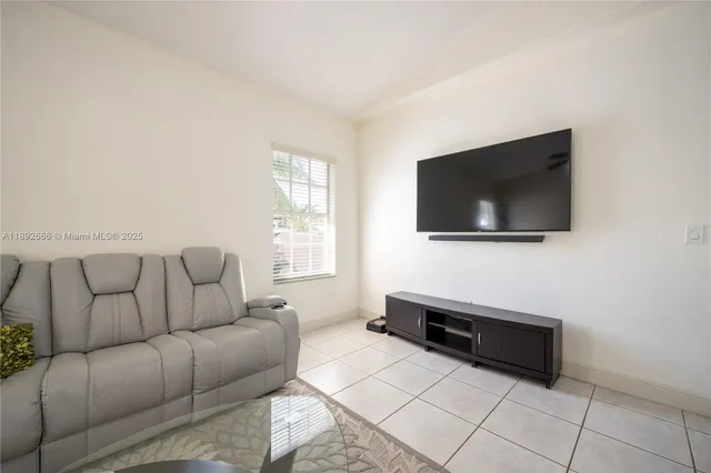 an aerial view of a house with a swimming pool yard and outdoor seating