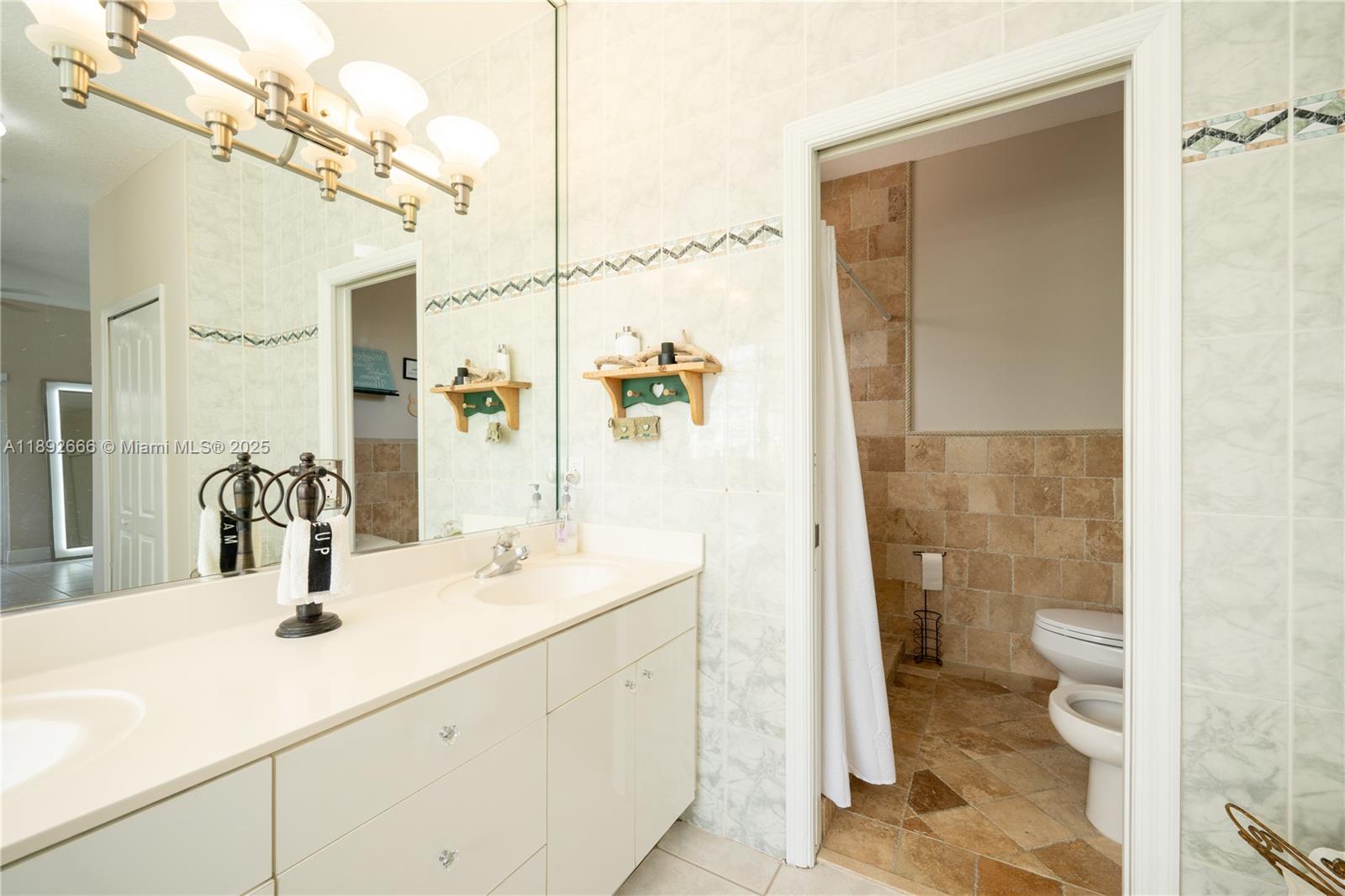 2275 Southwest 143rd Court Miami, FL 33175 - Photo 48 of 64 a bathroom with a sink a toilet and shower