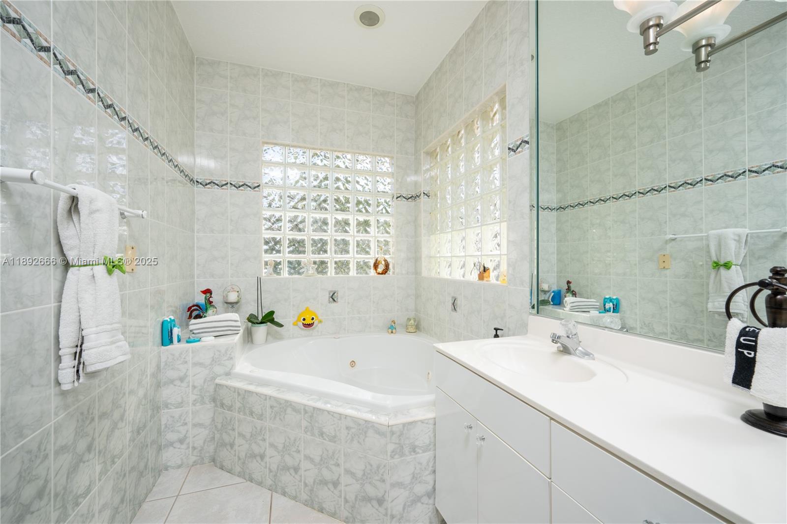 2275 Southwest 143rd Court Miami, FL 33175 - Photo 5 of 64 a bathroom with a sink tub vanity and shower