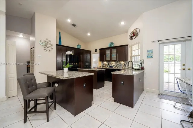 a bathroom with a bathtub sink and mirror