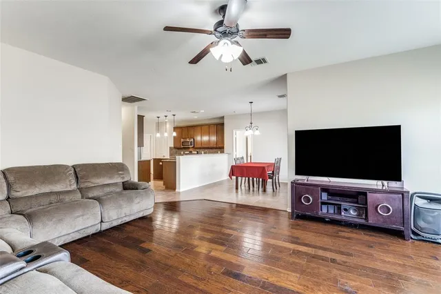 a view of a dining room with furniture and chandelier