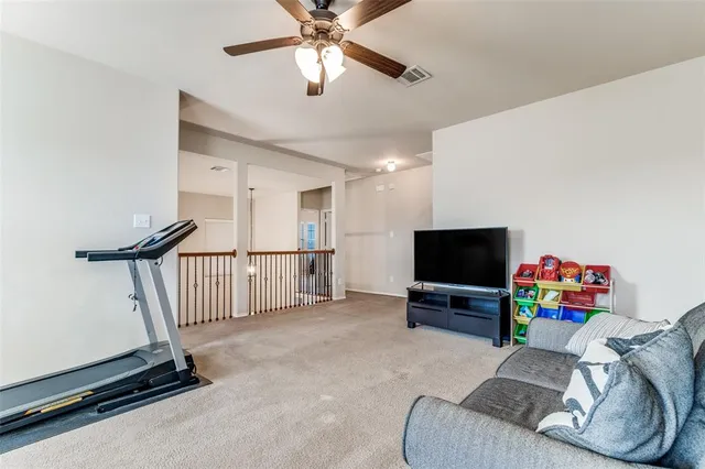 a bedroom with a bed and a chair