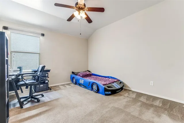 a view of an empty room with a large window