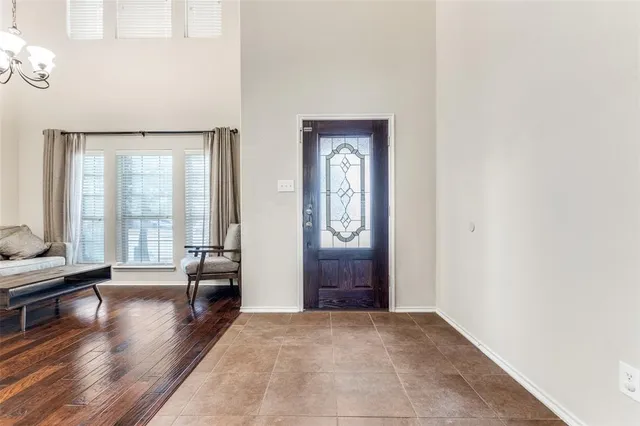 a view of a livingroom with wooden floor and stairs