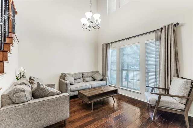 a kitchen with stainless steel appliances granite countertop a refrigerator a stove a sink and a microwave