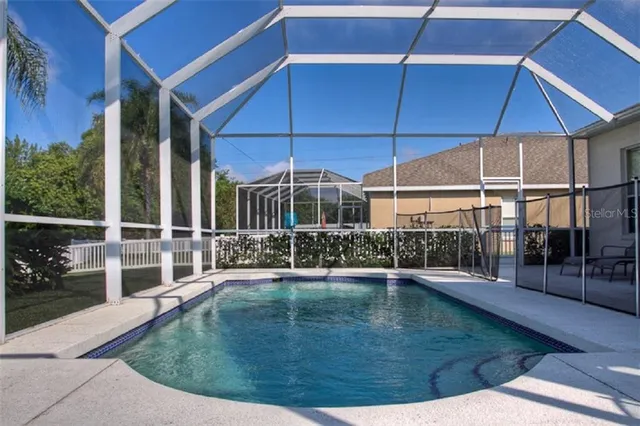 a view of a house with backyard and porch