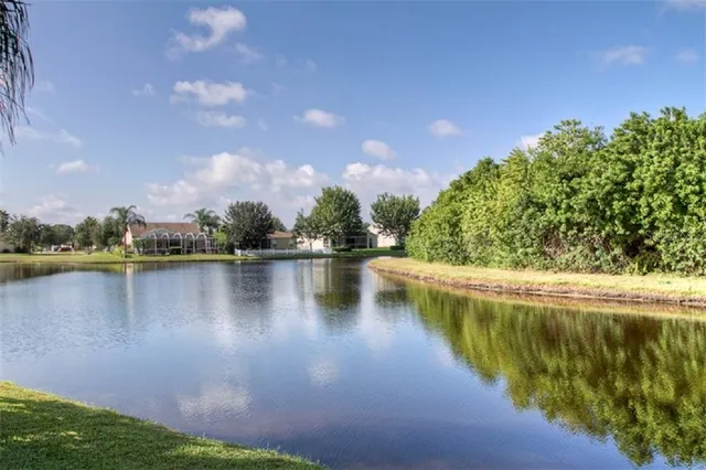 a view of a lake with houses in the background
