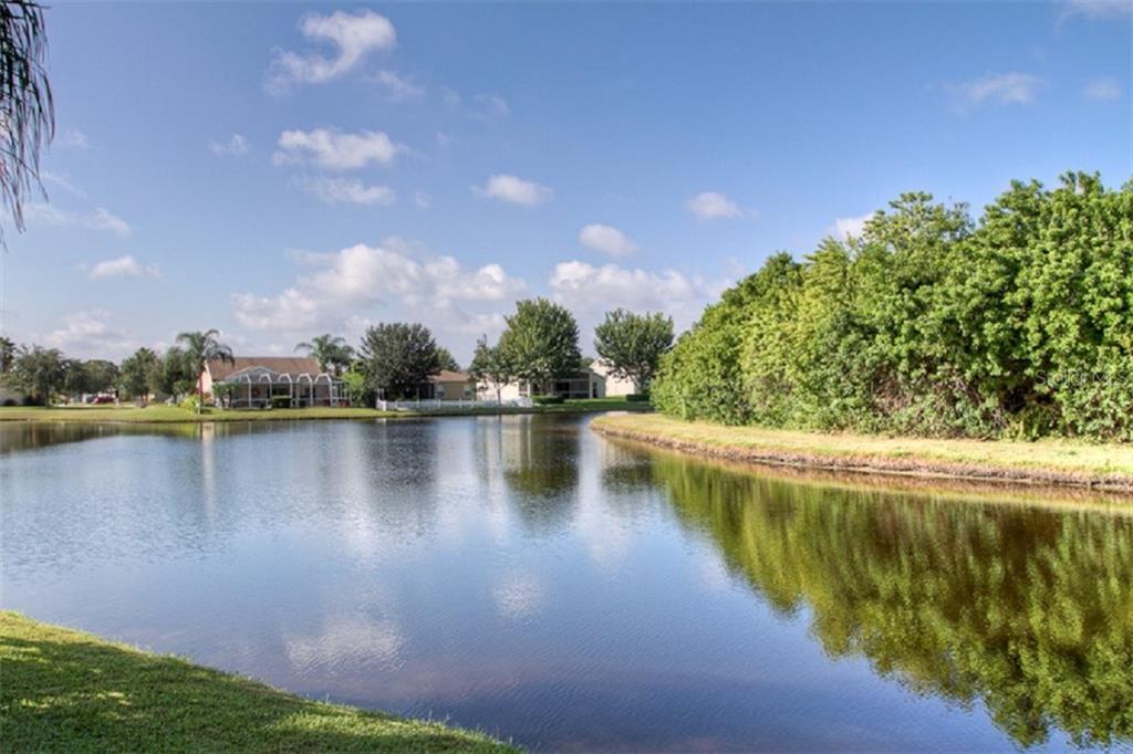 4418 Useppa Drive Bradenton, FL 34203 - Photo 20 of 22 a view of a lake with houses in the background
