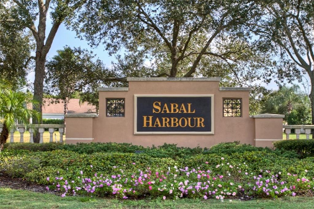 4418 Useppa Drive Bradenton, FL 34203 - Photo 22 of 22 a sign on the side of a building