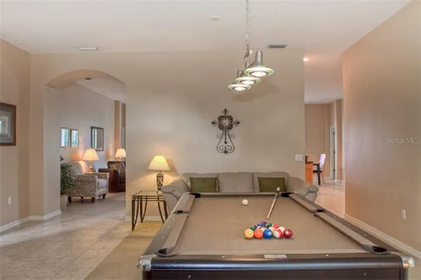 a room with a chandelier and couch