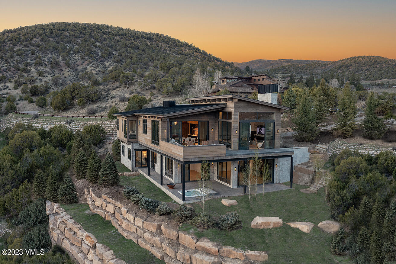 an aerial view of a house with a yard