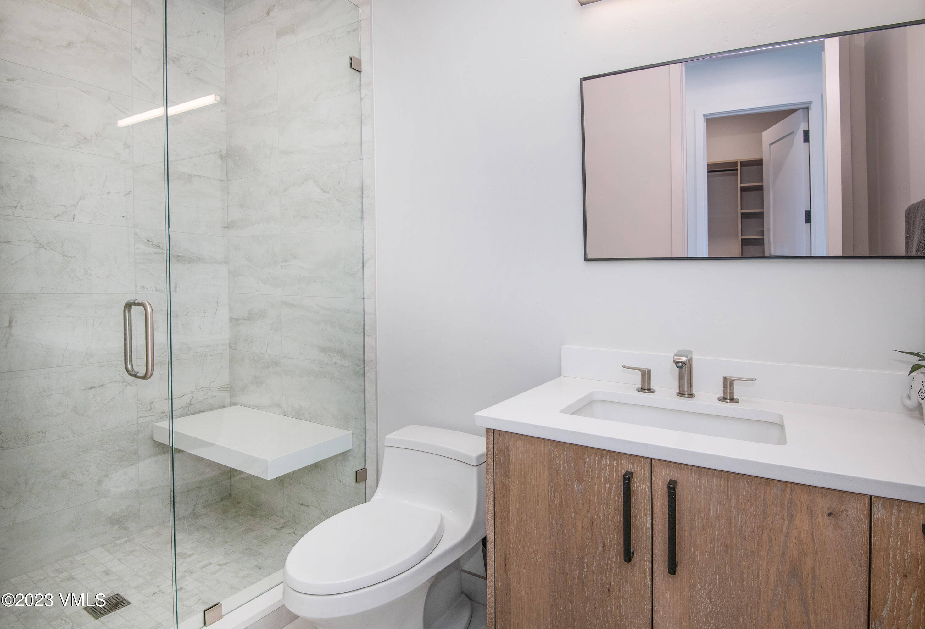 118 Juniper Ridge Road Edwards, CO 81632 - Photo 11 of 16 a bathroom with a sink toilet vanity and shower