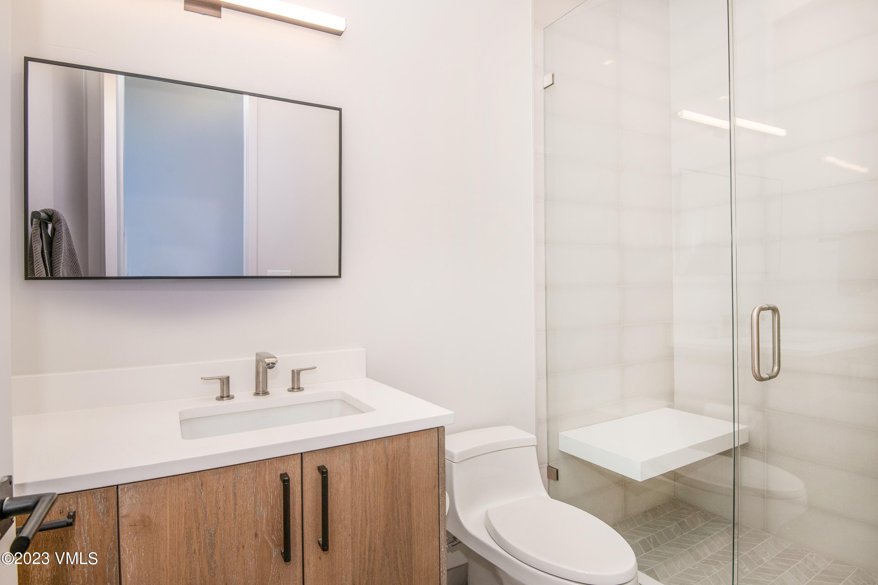 118 Juniper Ridge Road Edwards, CO 81632 - Photo 13 of 16 a bathroom with a toilet a sink and mirror