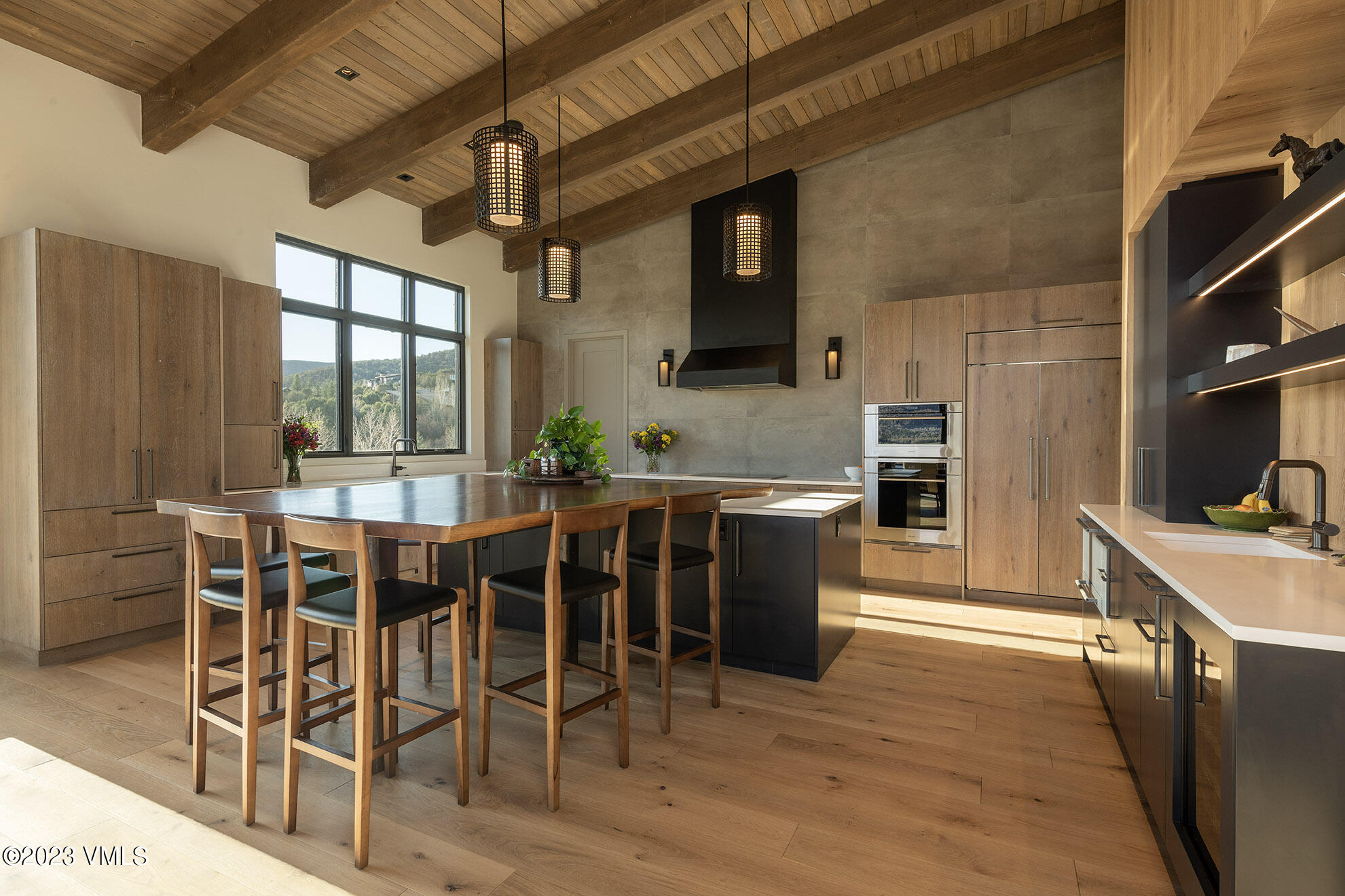 118 Juniper Ridge Road Edwards, CO 81632 - Photo 2 of 16 a dining table with chairs and kitchen view