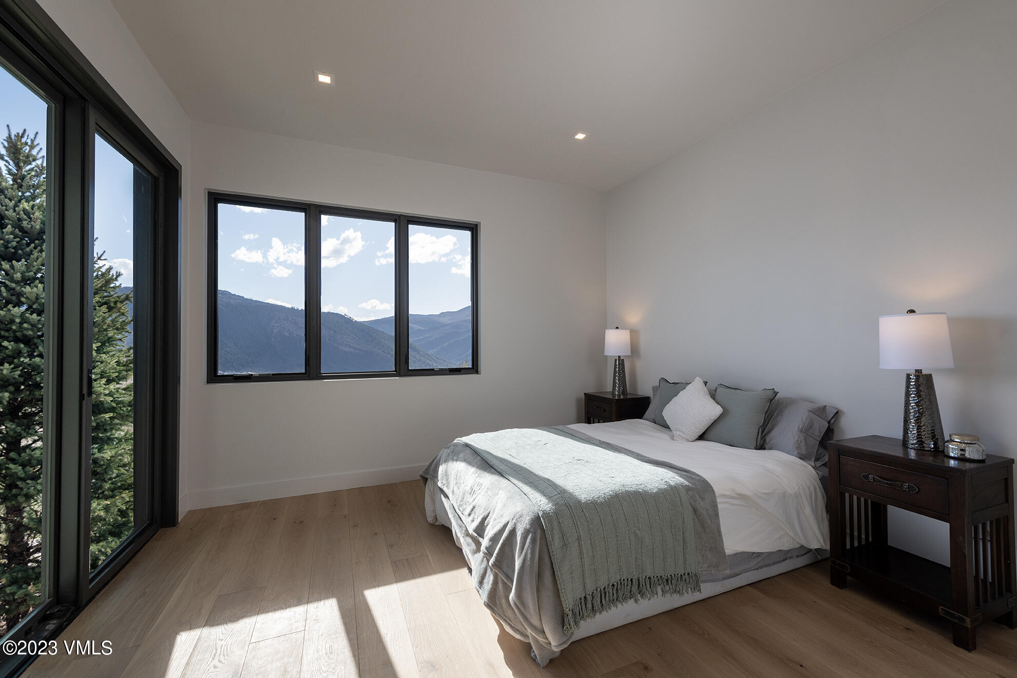 118 Juniper Ridge Road Edwards, CO 81632 - Photo 10 of 16 a bedroom with a large bed and a large window