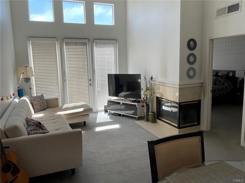 2233 Martin, Unit 413 Irvine, CA 92612 - Photo 23 of 45 a living room with furniture and a flat screen tv