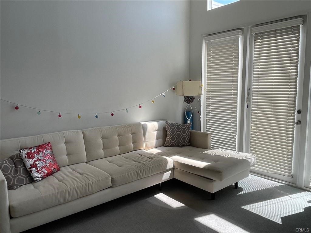 2233 Martin, Unit 413 Irvine, CA 92612 - Photo 25 of 45 a living room with furniture and a window