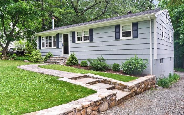 37 Silver Spring Park Road Ridgefield, CT 06877 - Photo 1 of 1 a front view of a house with a yard