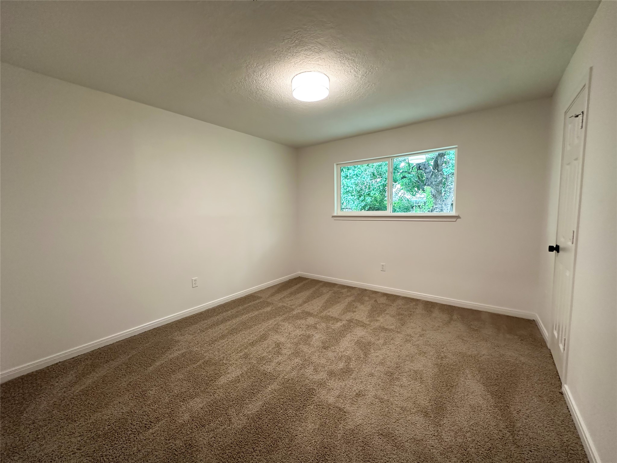 29310 Loddington Street Spring, TX 77386 - Photo 11 of 23 an empty room with windows