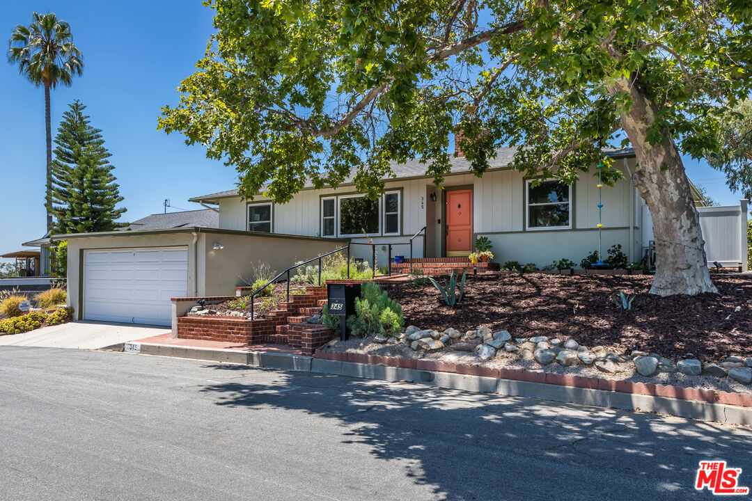 a front view of a house with patio