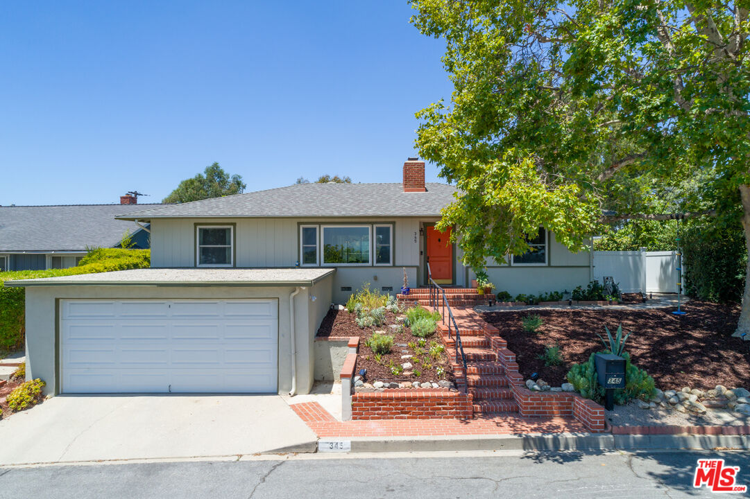 345 Sequoia Drive Pasadena, CA 91105 - Photo 2 of 8 a front view of a house with garden