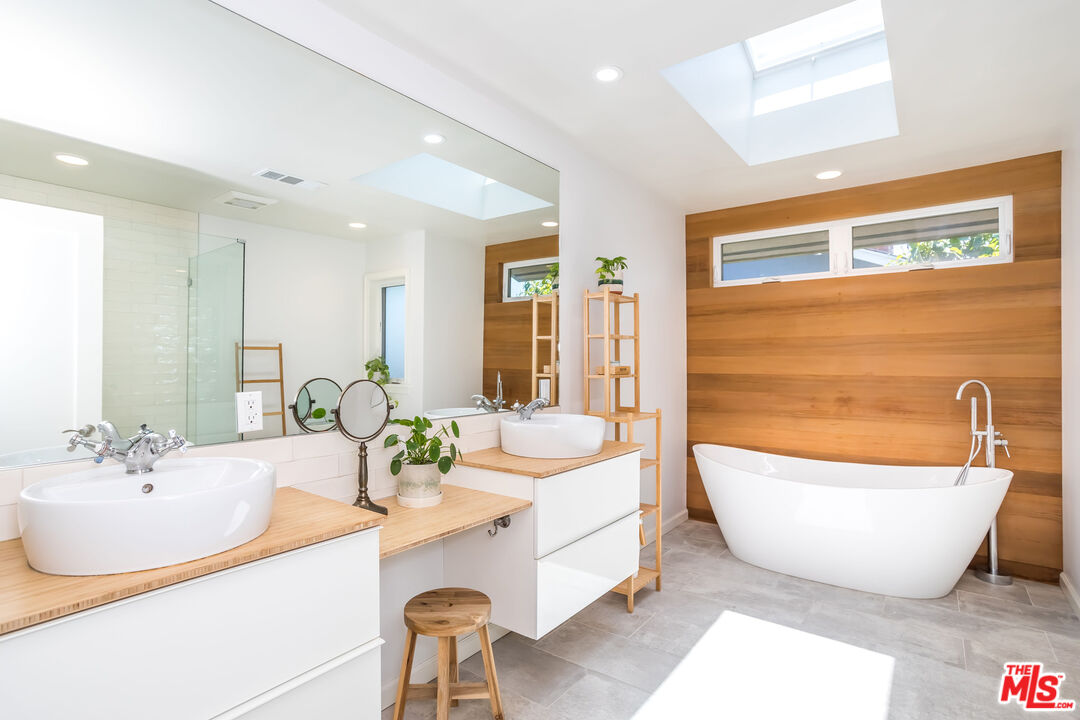 345 Sequoia Drive Pasadena, CA 91105 - Photo 6 of 8 a spacious bathroom with a bathtub and 2 sink