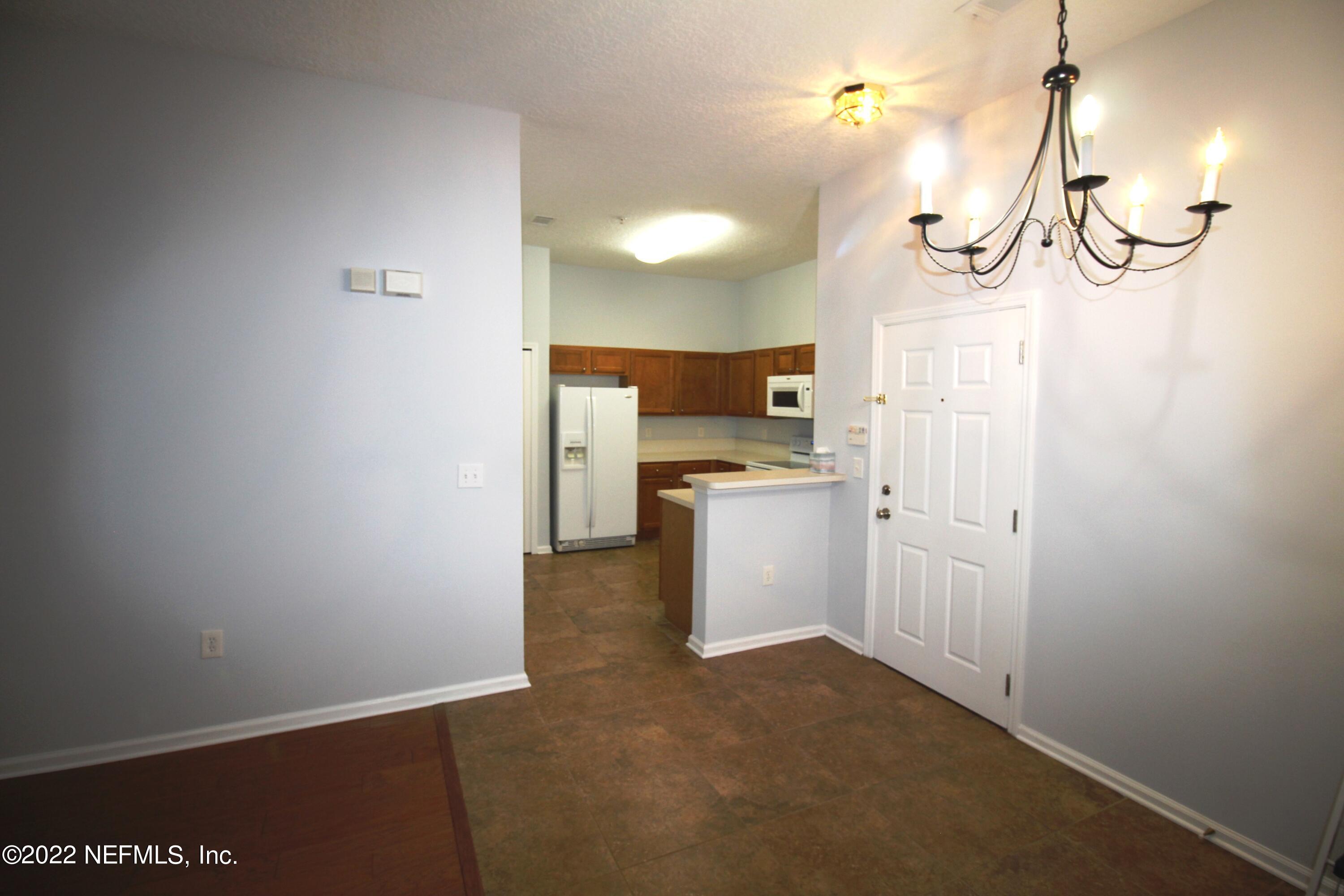 7920 Merrill Road, Unit 701 Jacksonville, FL 32277 - Photo 8 of 24 a view of a kitchen with a sink