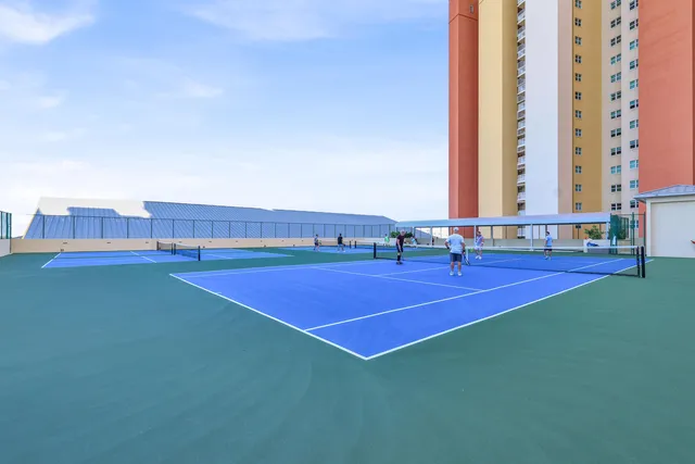 a view of a swimming pool with a yard