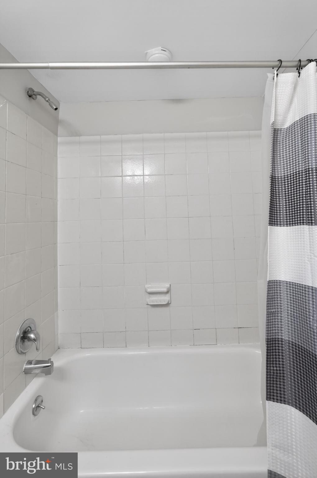364 Saybrook Lane Wallingford, PA 19086 - Photo 13 of 14 Modern bathroom with sleek tub and shower.