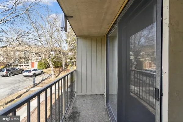 a view of balcony with wooden floor