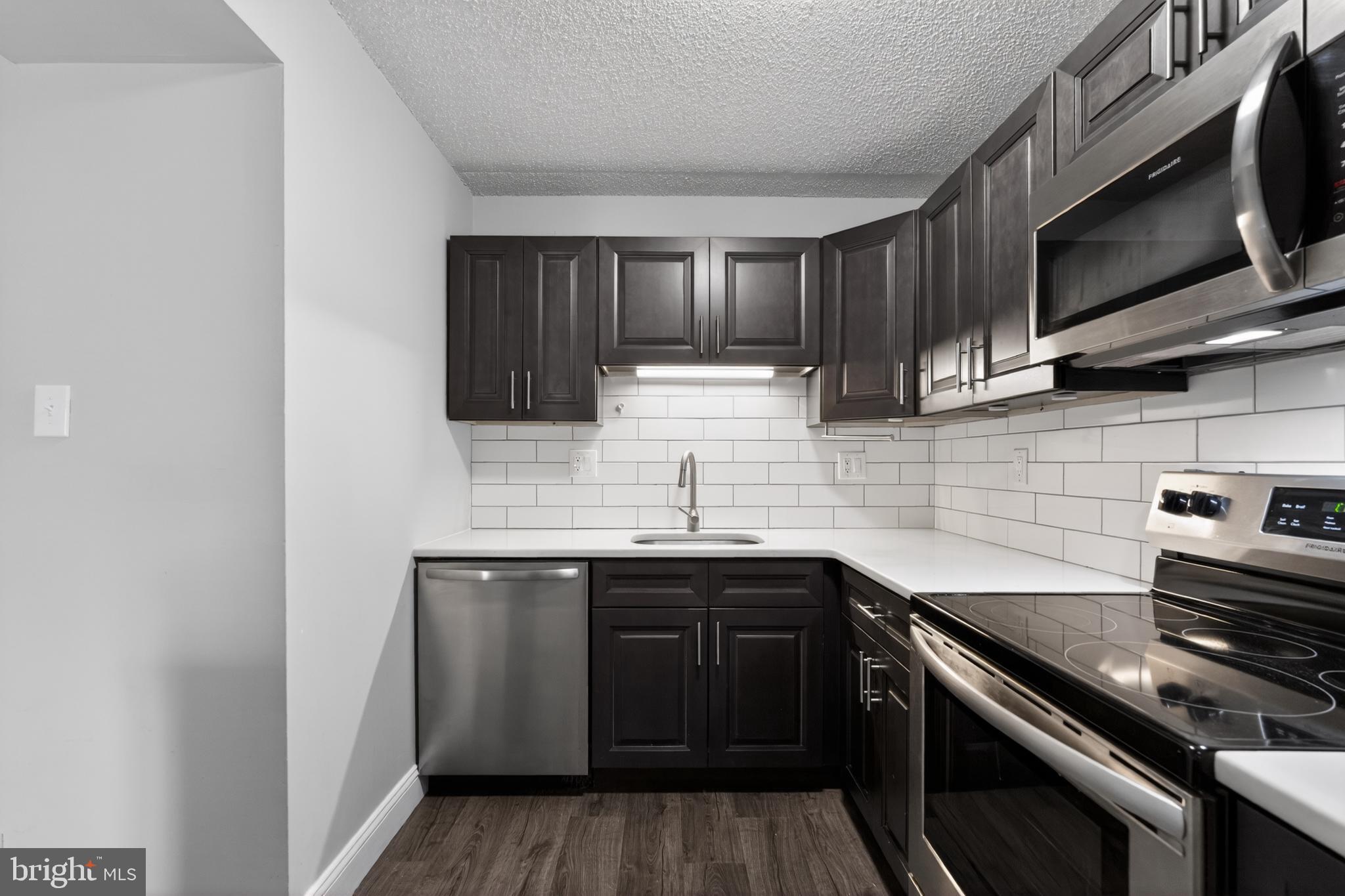 364 Saybrook Lane Wallingford, PA 19086 - Photo 5 of 14 Sleek modern kitchen with stylish finishes.