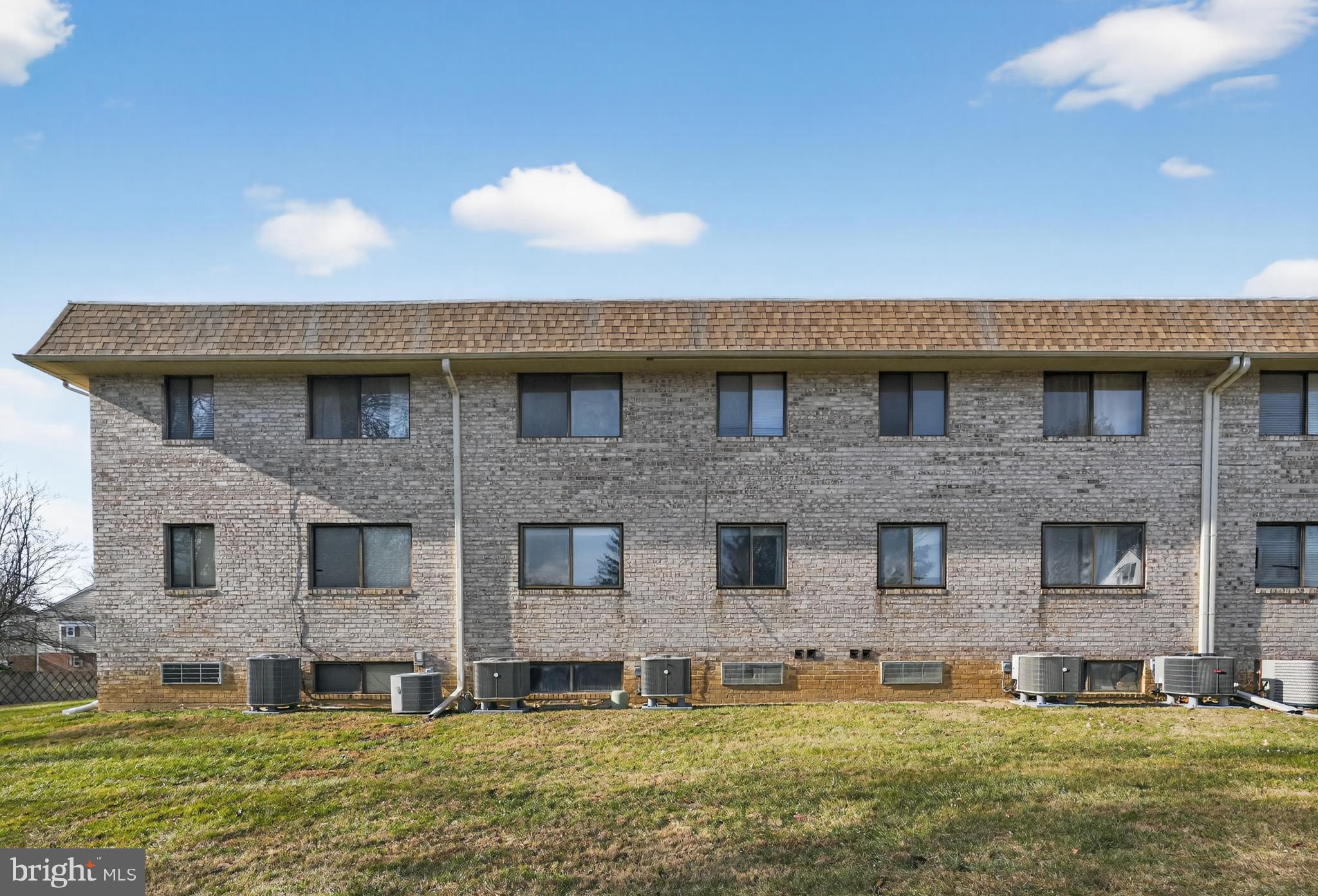 364 Saybrook Lane Wallingford, PA 19086 - Photo 9 of 14 Modern brick apartment building exterior.