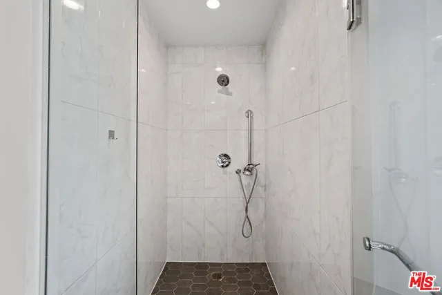 a bathroom with a glass shower door