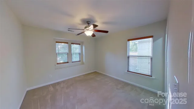 a view of a house with a back yard