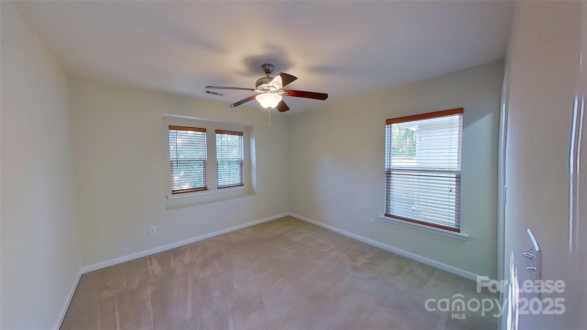 9029 Seamill Road Charlotte, NC 28278 - Photo 13 of 15 a view of a room with a ceiling fan and a window