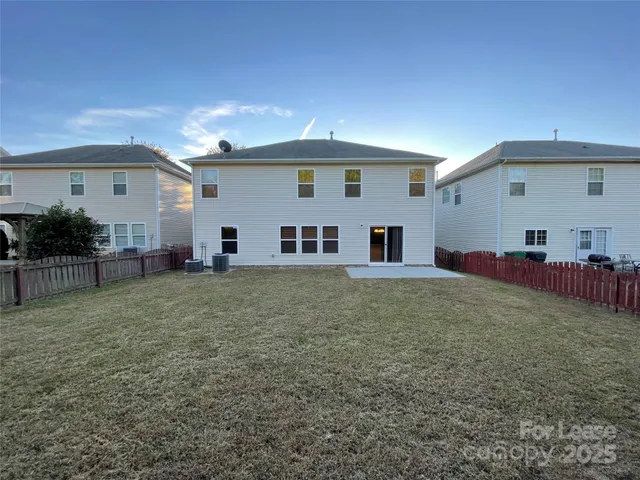 a view of backyard with green space
