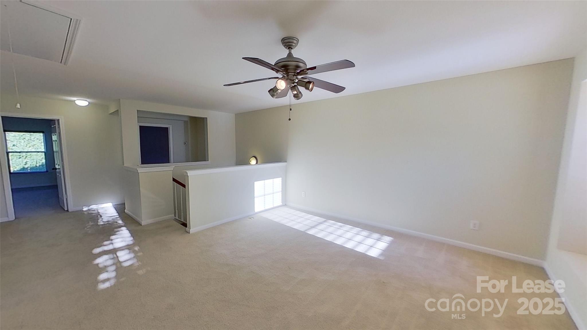 9029 Seamill Road Charlotte, NC 28278 - Photo 8 of 15 a view of a livingroom with a ceiling fan and window