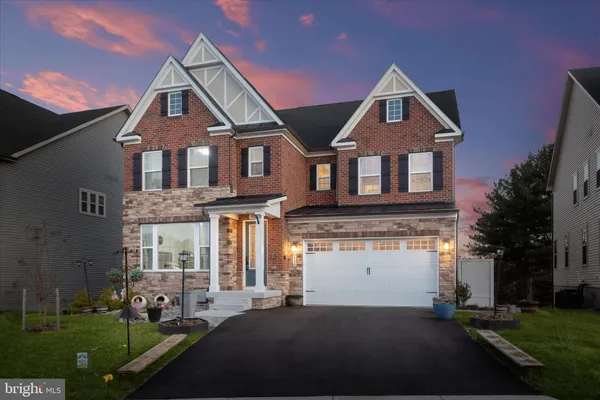 a kitchen with a stove a sink and a refrigerator