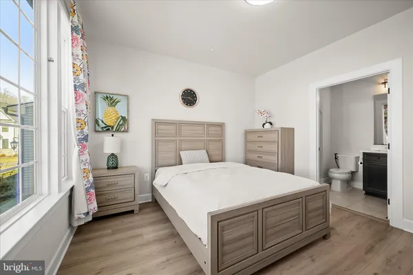 a view of a house with a yard and pathway