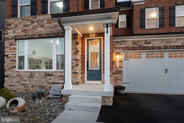 a kitchen with stainless steel appliances white cabinets and a sink