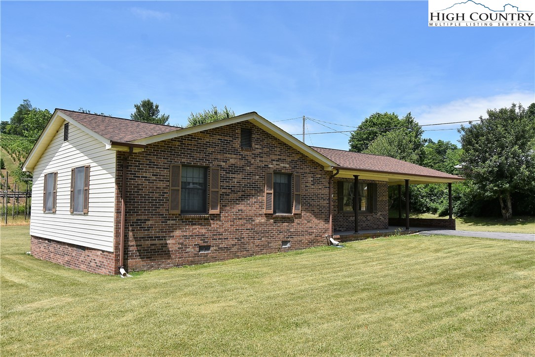 114 Dolinger Road Whitetop, VA 24292 - Photo 1 of 28 a front view of a house with a yard