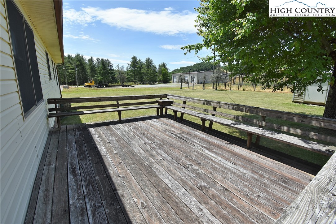 114 Dolinger Road Whitetop, VA 24292 - Photo 23 of 28 a view of outdoor space with seating water view and trees in the background