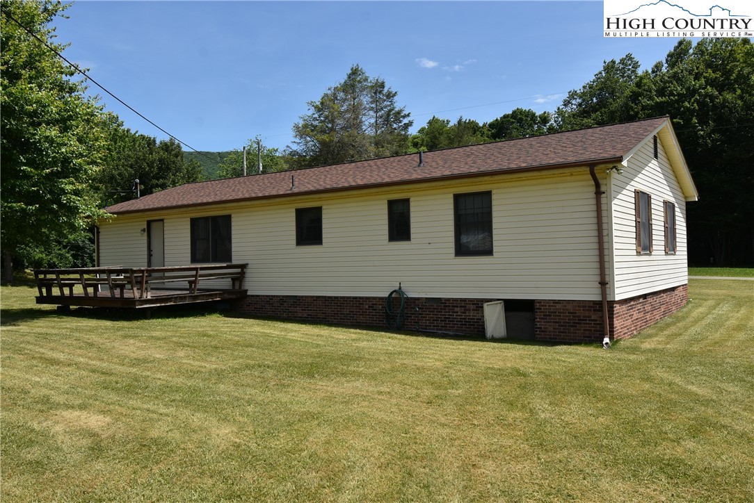 114 Dolinger Road Whitetop, VA 24292 - Photo 4 of 28 a front view of house with yard and trees in the background